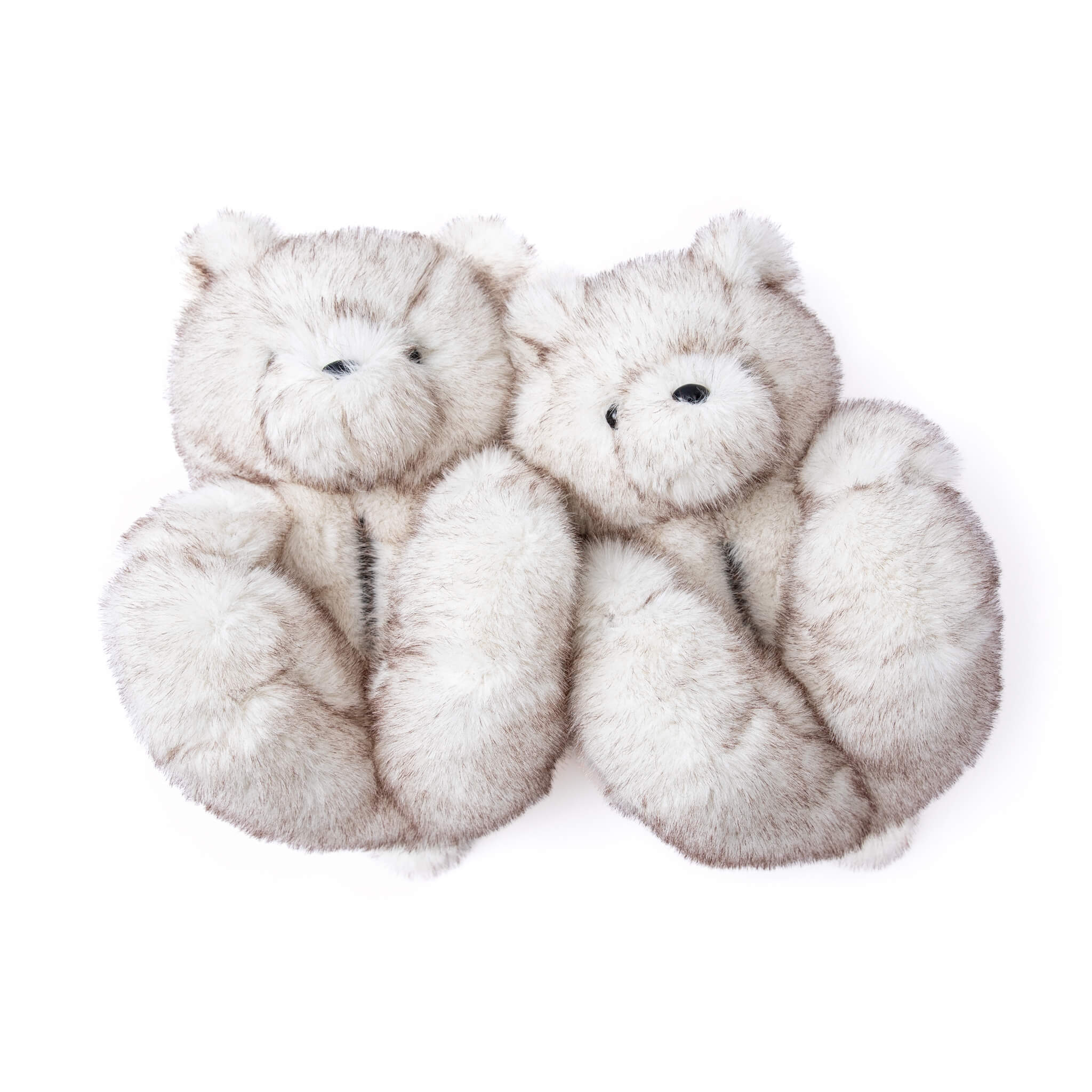 Pair of White furry teddy bear slippers shoes on a white background