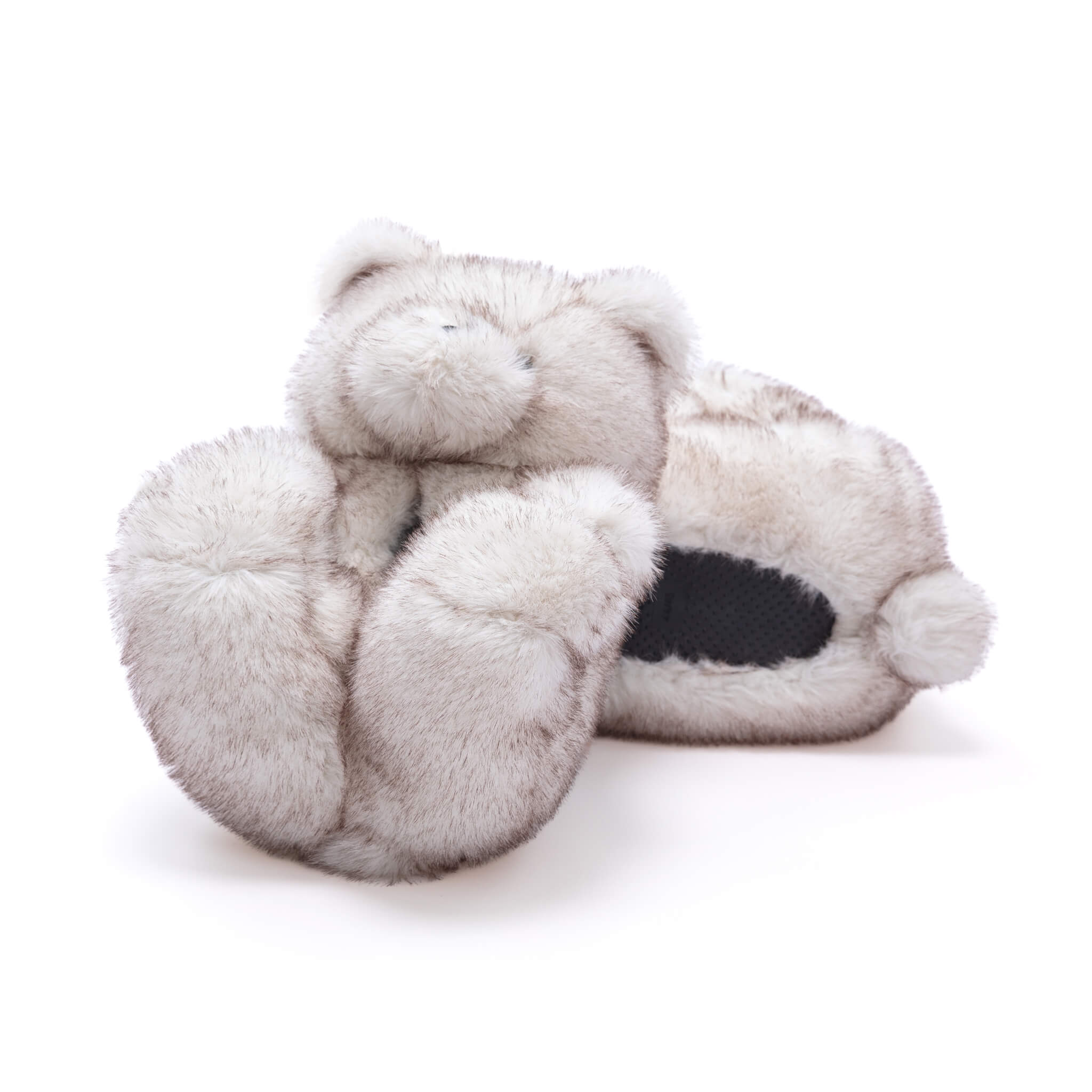 Pair of White furry teddy bear slippers shoes on a white background