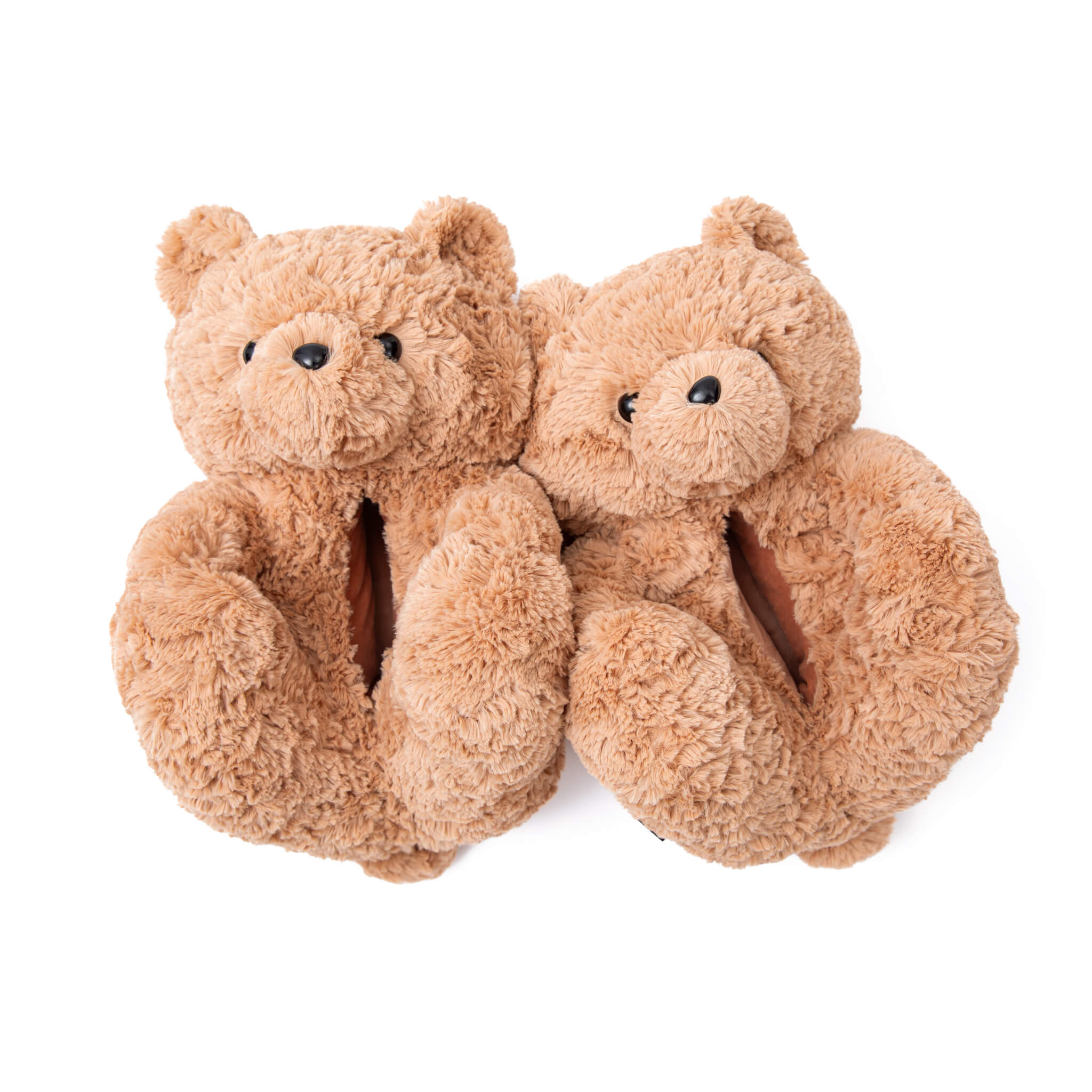 Pair of brown beige curly swirly teddy bear slippers shoes on a white background