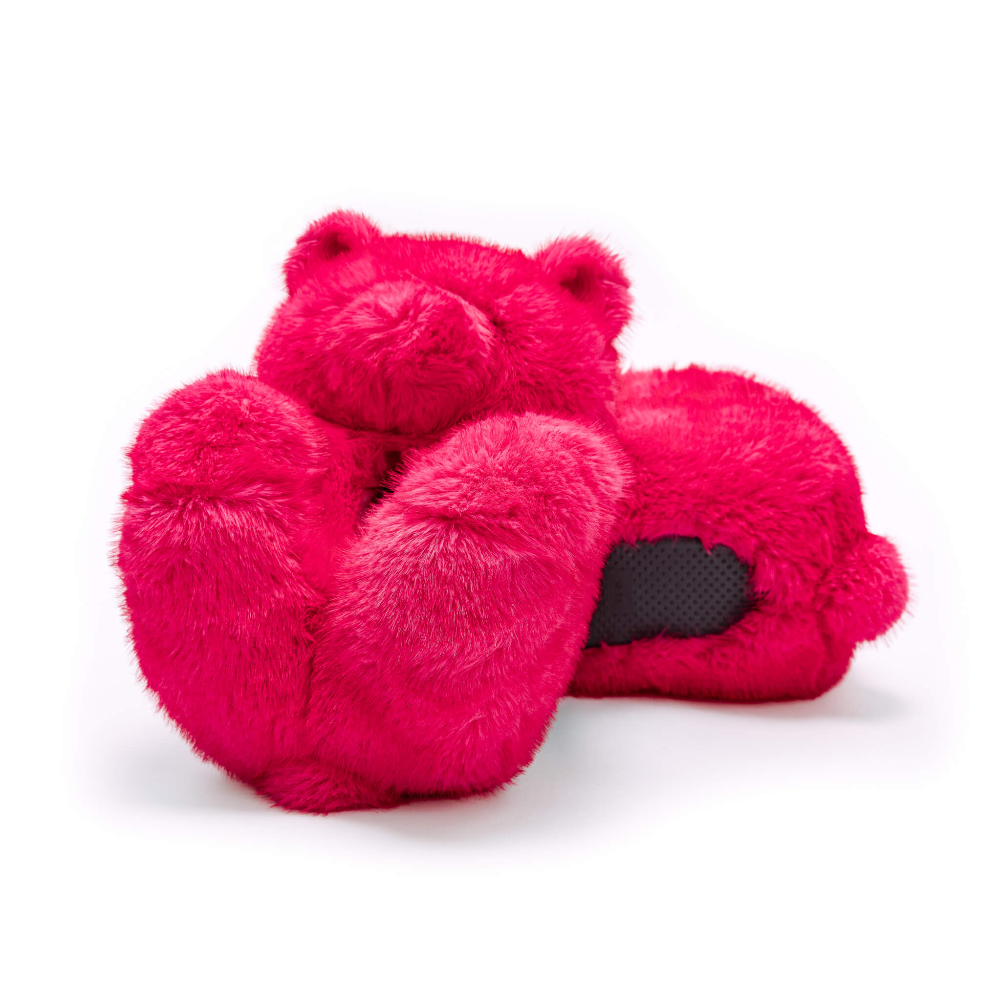 Pink teddy bear slippers on a white background