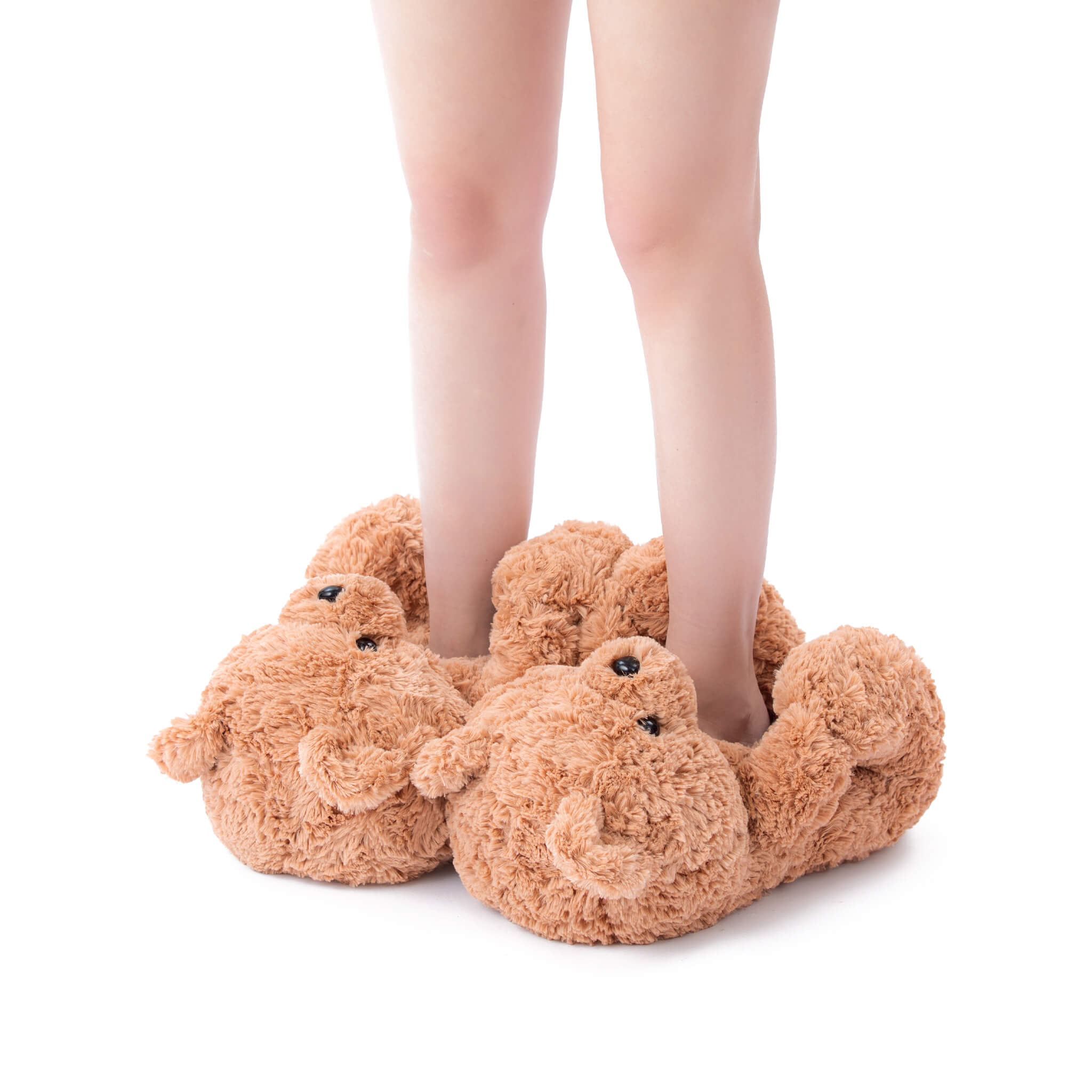 brown beige curly fuzzy slippers shoes worn by a person on a white background