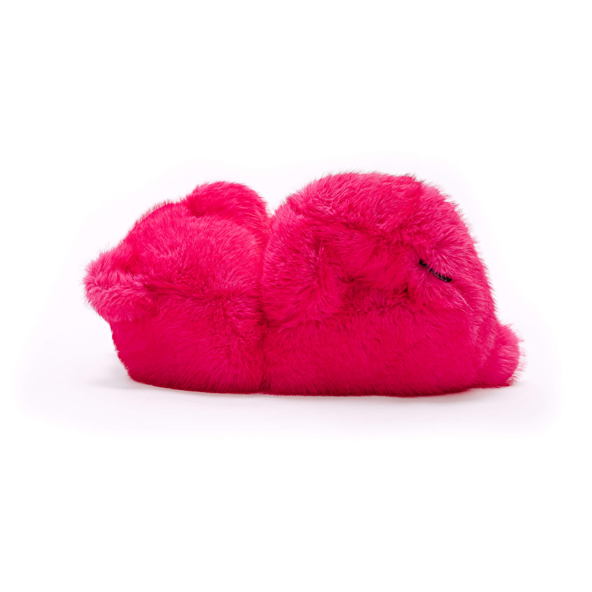 Pair of bright pink fuzzy slippers on a white background